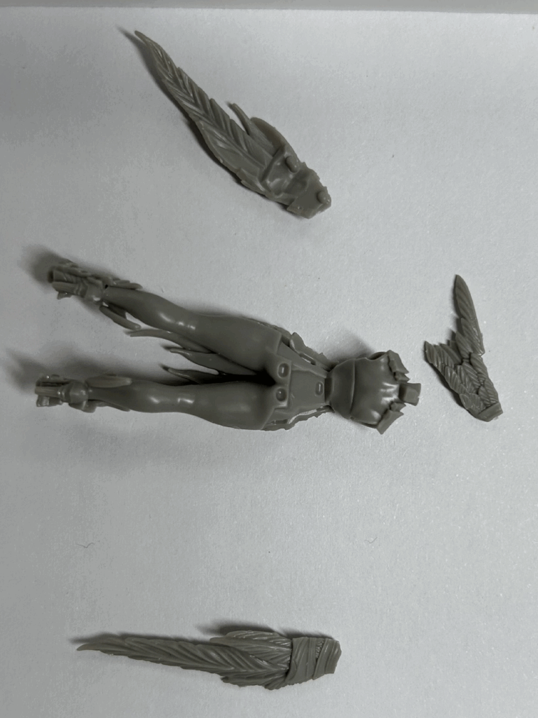 A close up of several parts of a hard plastic model.